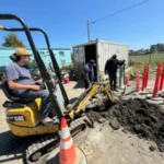 group of men digging with construction tools