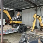 excavators parked on a trailer